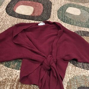 Burgundy sweater ties in front
